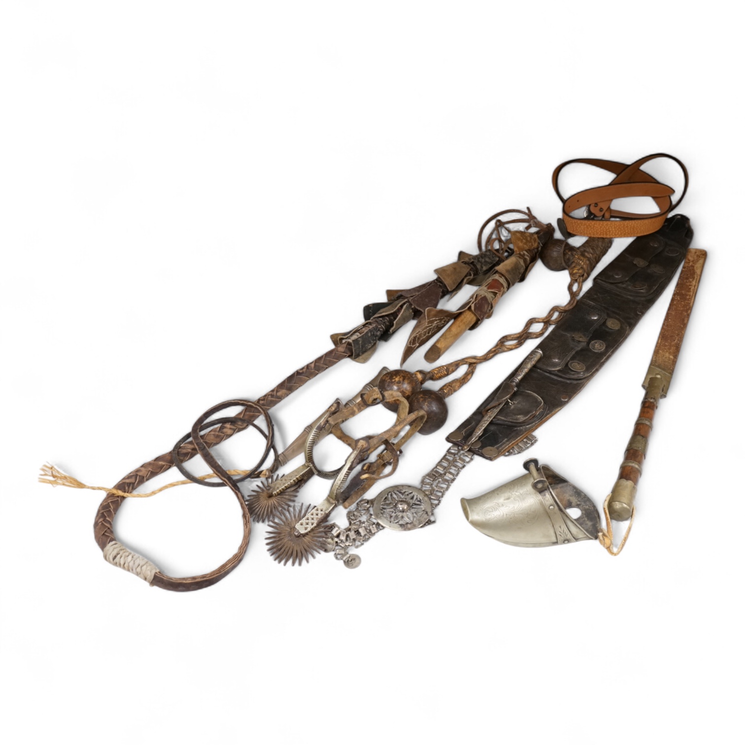 A group of Argentinian Gaucho spurs, bolas, bull whip, daggers and hanger, Longest 100cm